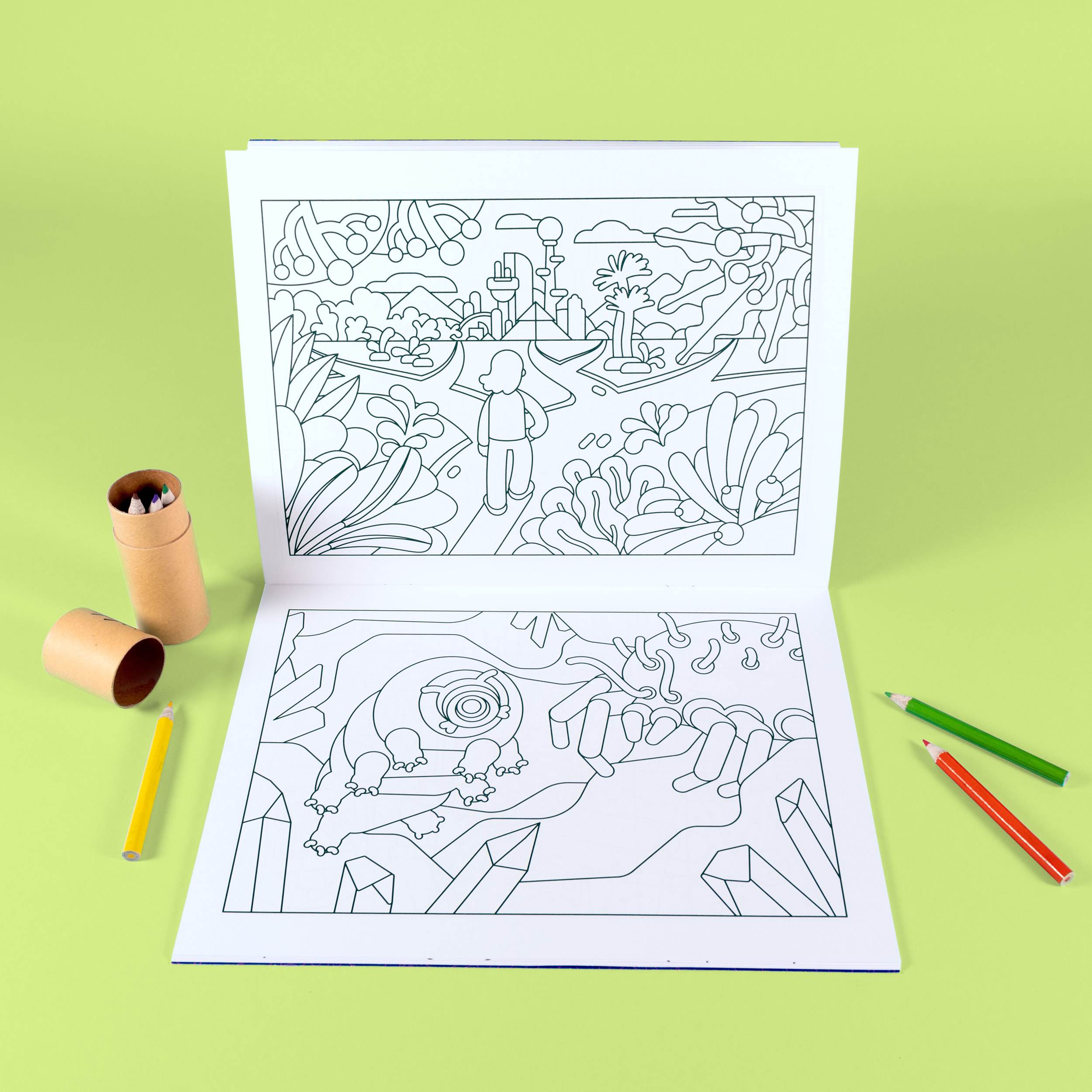 Open Coloring Book with nature scenes, surrounded by colored pencils and cardboard tubes.