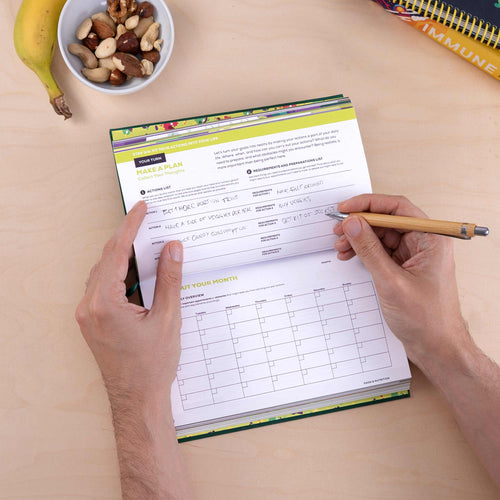 Person using the health journal to create a plan